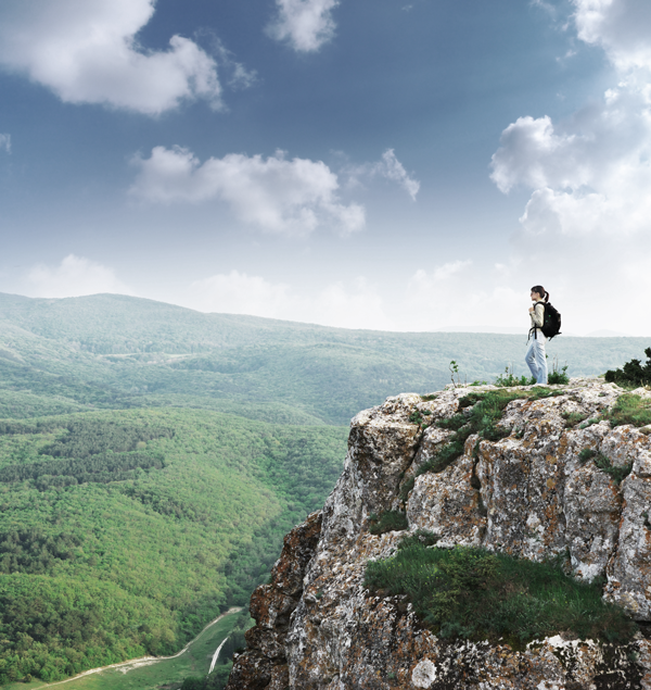 Picture of a lady atop a cliff